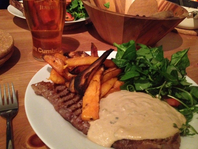 Steak with peppercorn sauce, sweet potato chips and baby spinach salad. 