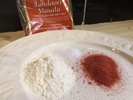 Spice mix, flour and salt on a plate